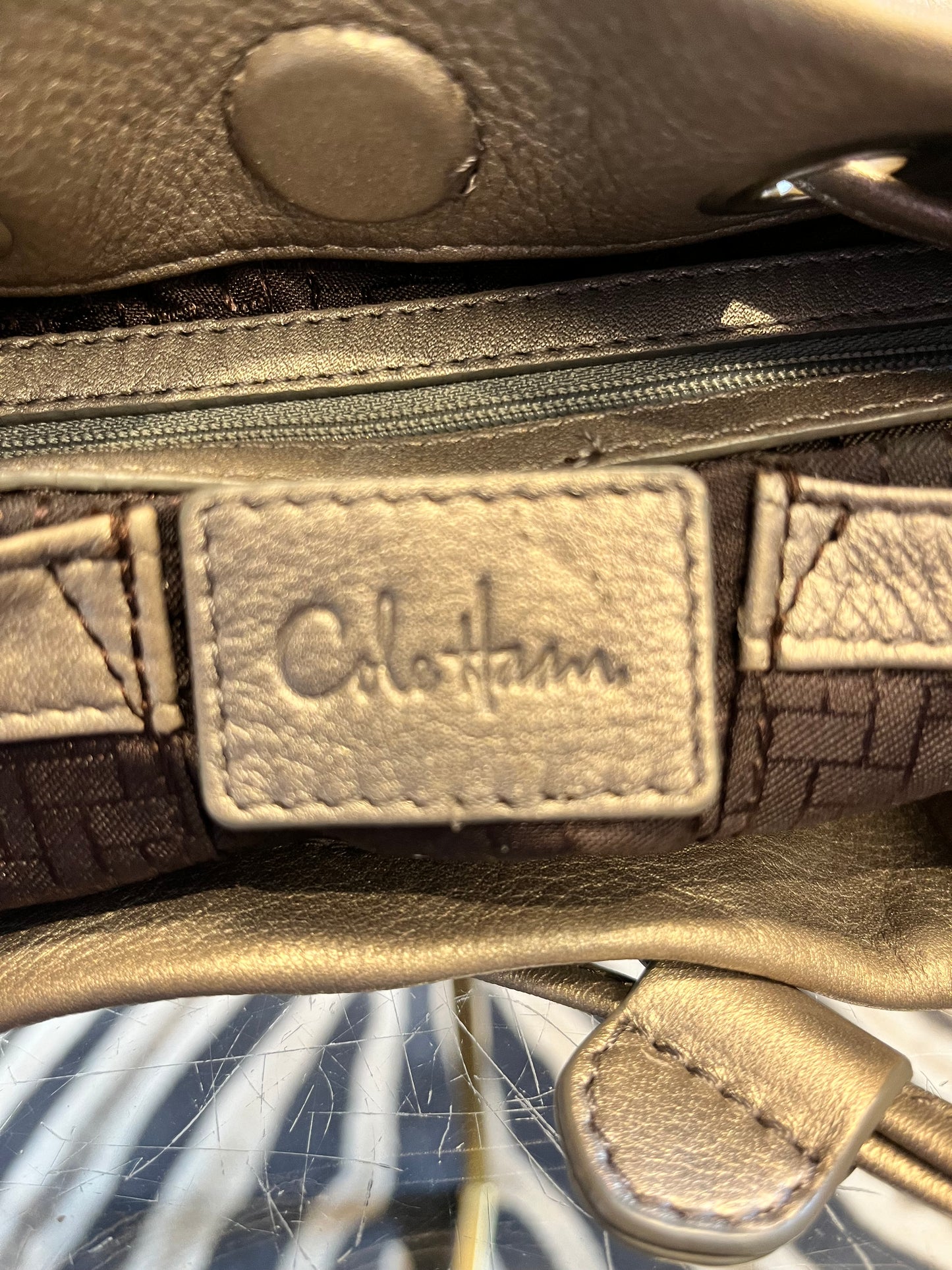 Cole Haan metallic pewter leather draw string handbag